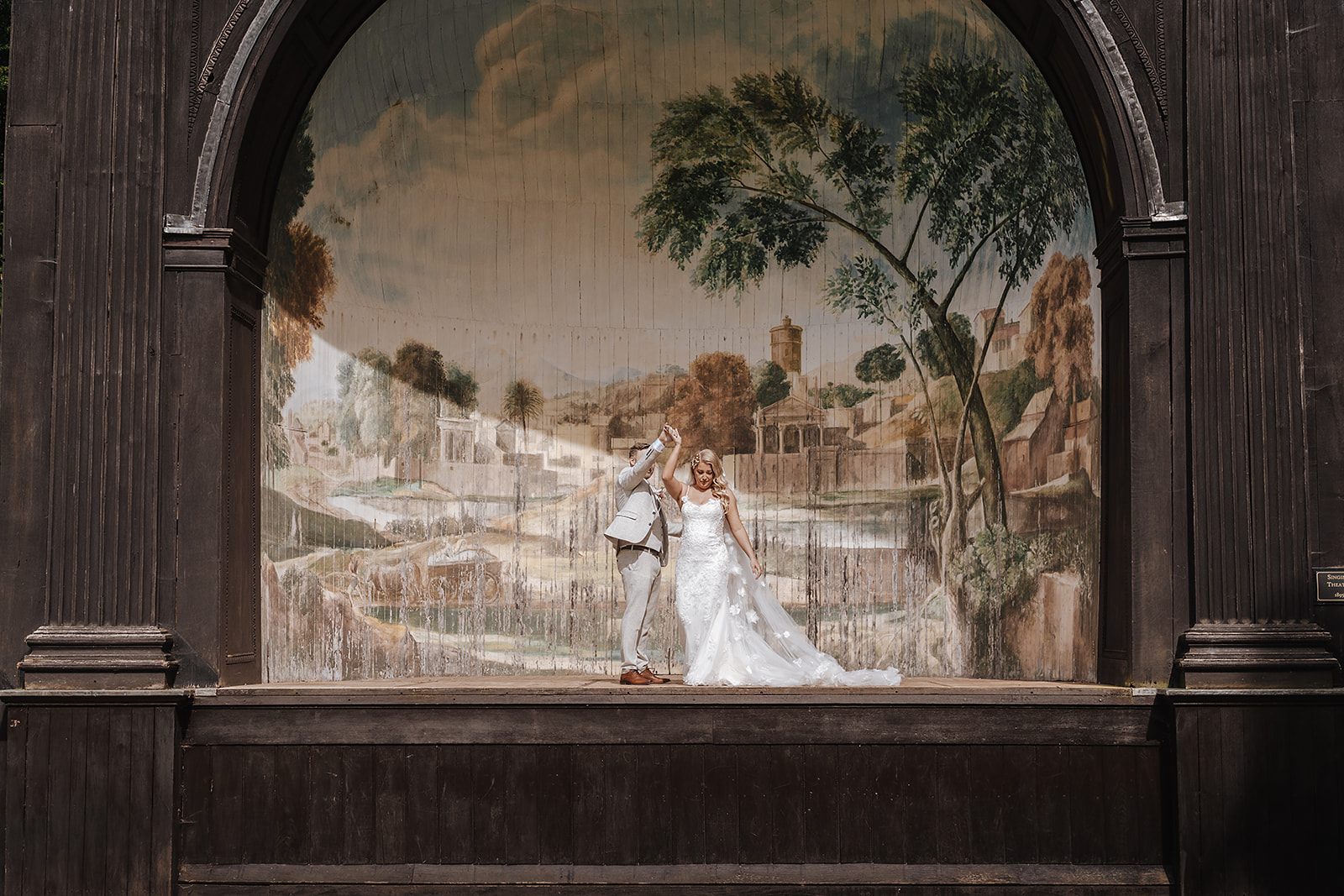 couple on singing theatre at Larmer Tree